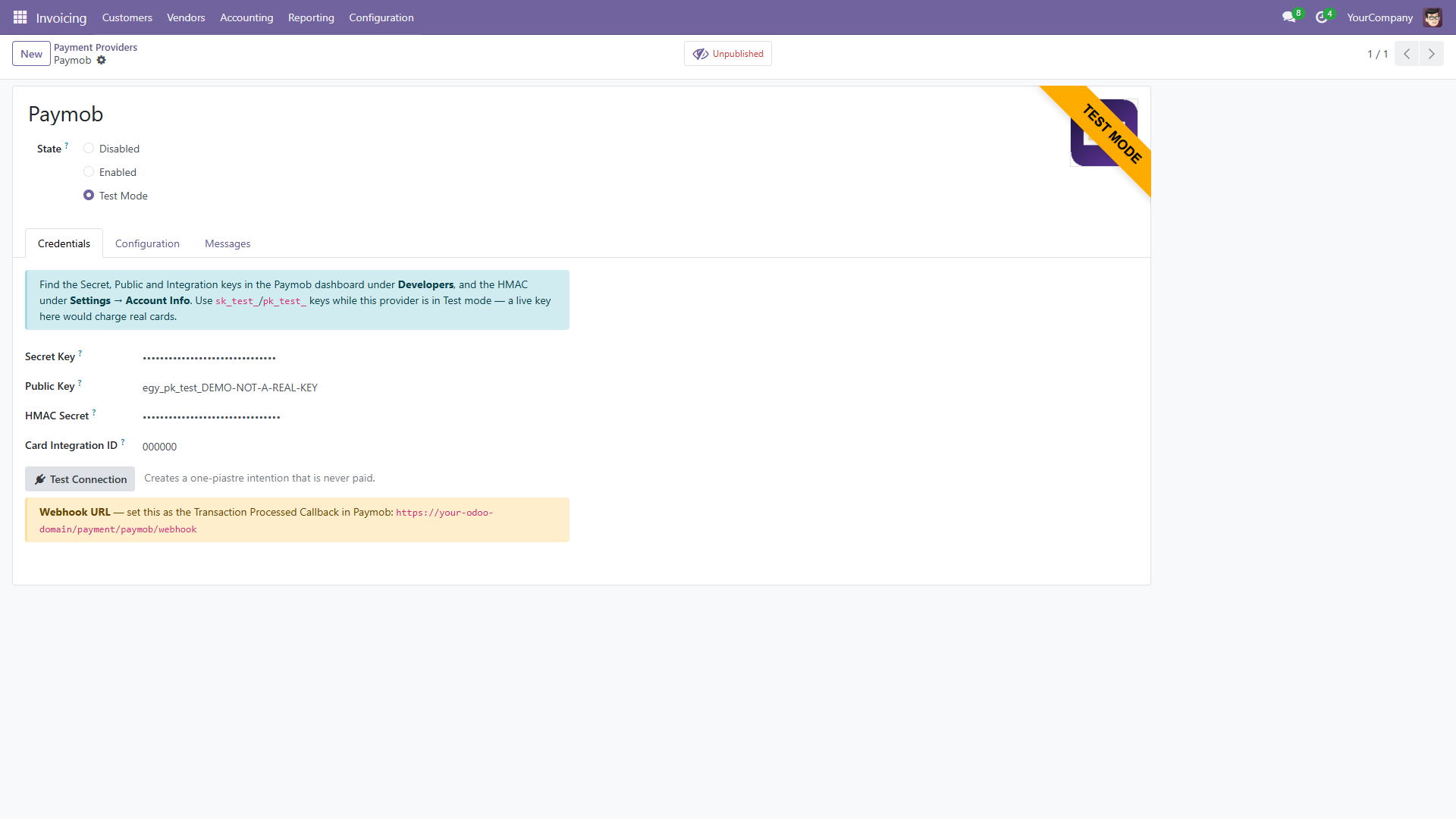 The Paymob payment provider in test mode with the secret key and HMAC secret masked, the visible key reading DEMO-NOT-A-REAL-KEY, and the webhook URL to set in Paymob.